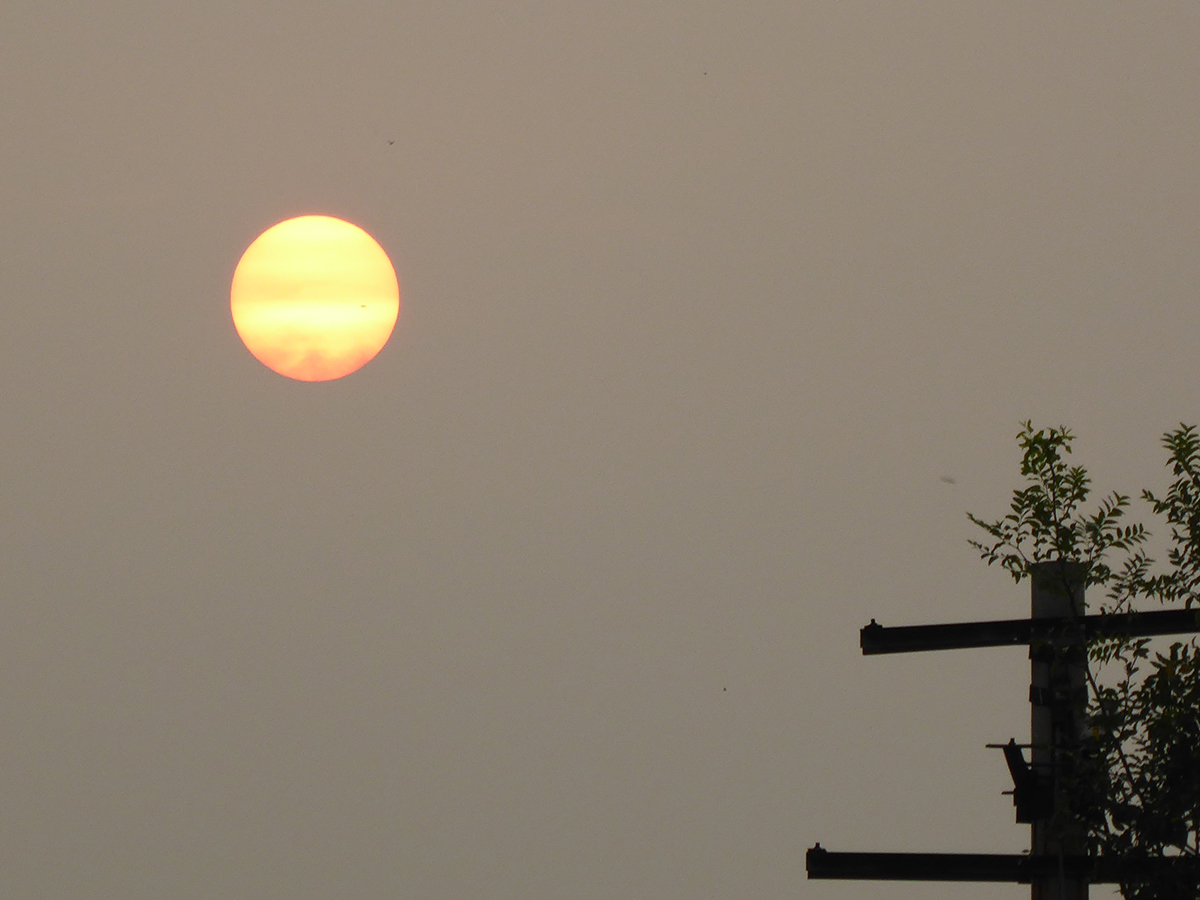 Smog obscures sun and sky on an August morning in Beijing, 2016.